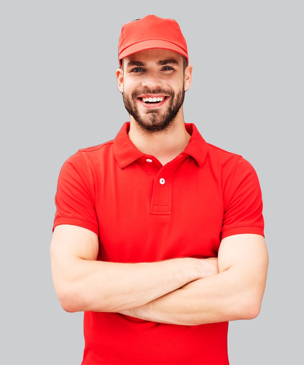 smiling caucasian delivery man standing with cross mefycwg.jpg
