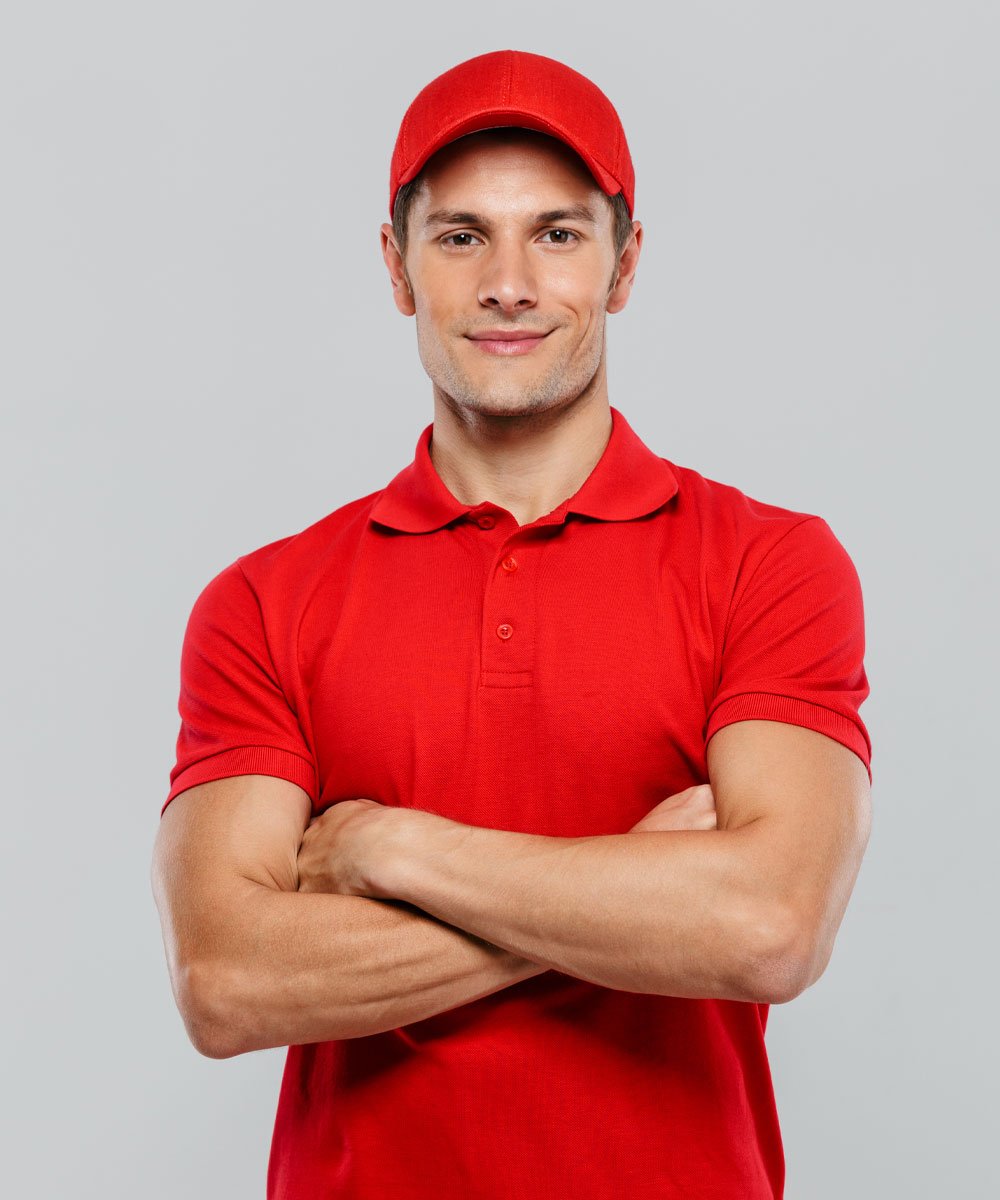young delivery man smiling while posing with arms 7442snp.jpg