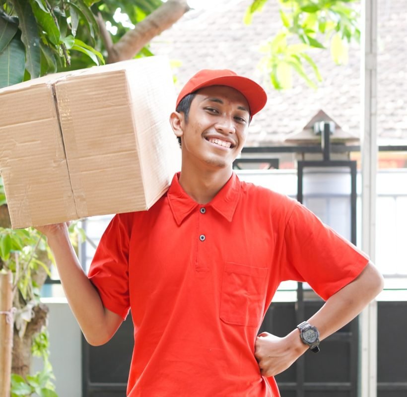 delivery man delivers the box in front of the customer s house.jpg