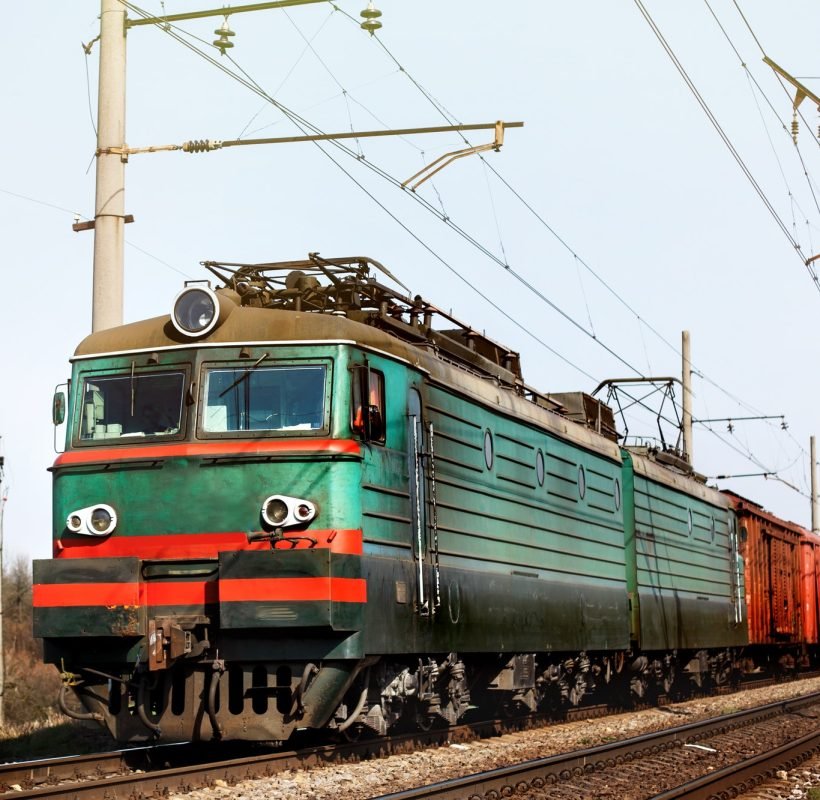 front of old train crossing railway and transporting goods carriage transportation concept.jpg